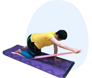 woman exercising using resistance band on mat