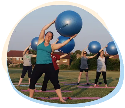 outdoor fitness class with gym balls